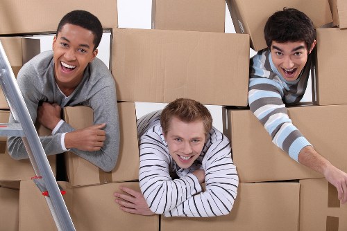 Professional removals and storage service in Oldmalden with moving boxes and furniture
